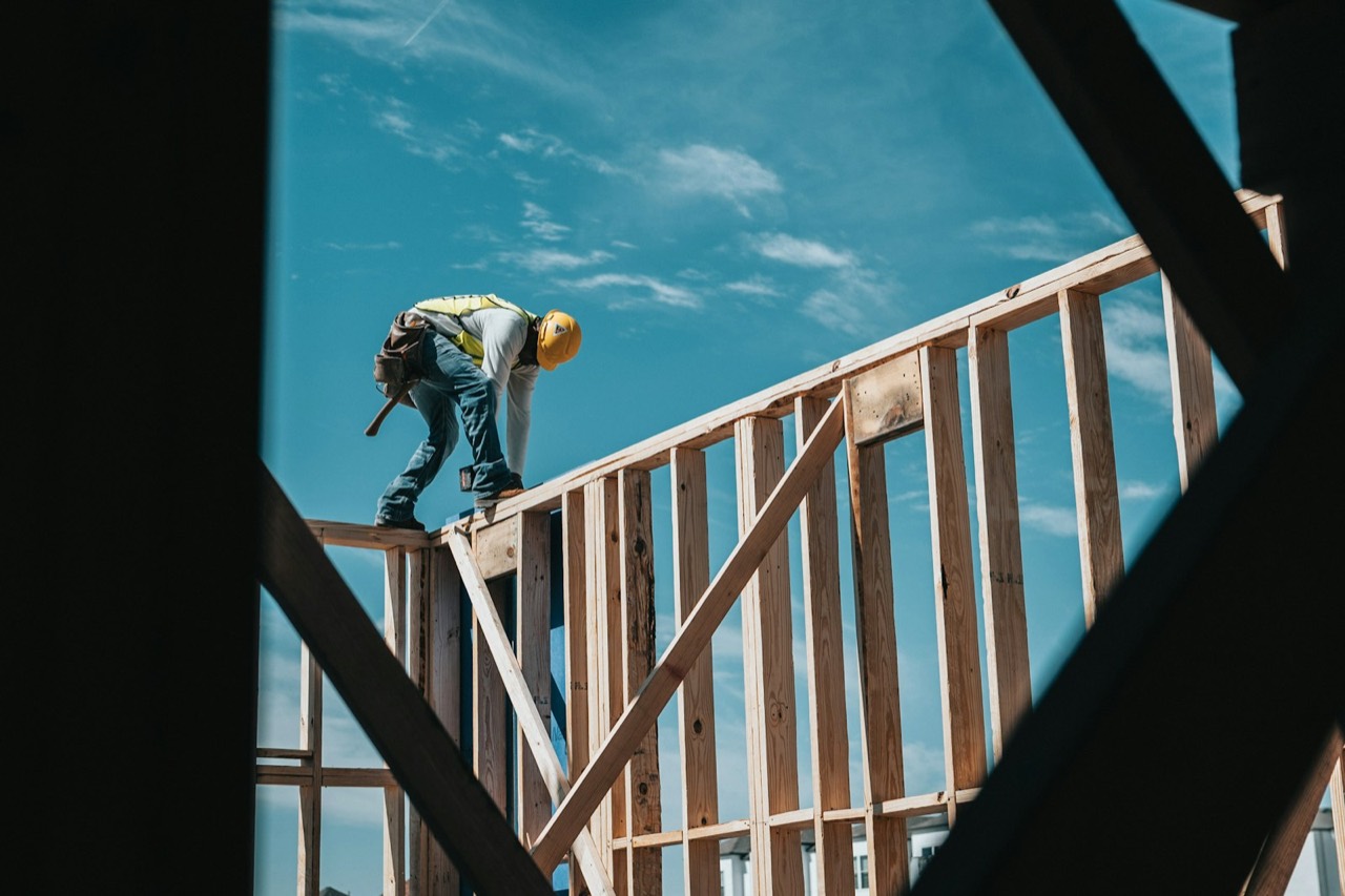 Carpenter framing a second-story addition